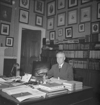 The Honourable James Cranswick Tory in the Study of Government House